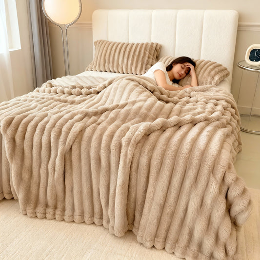 Bunny-plush throw draped over a sofa
