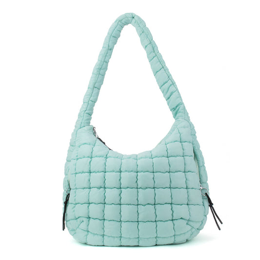 Puffer hobo tote bag shown from the side, quilted finish