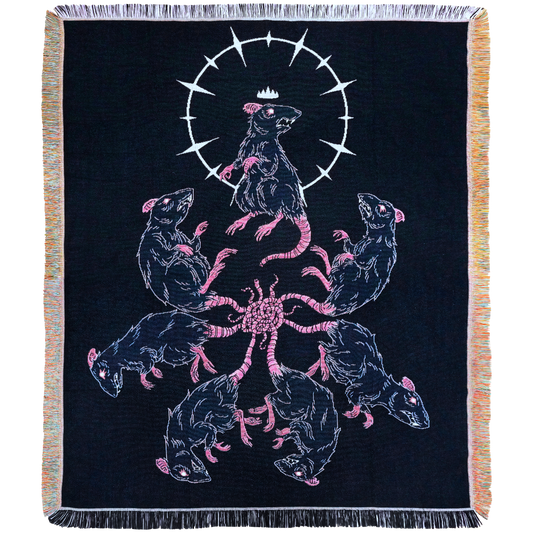 Rat King blanket draped over a sofa