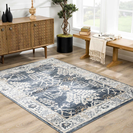 Living room with a blue patterned rug, wooden sideboard, and bench.