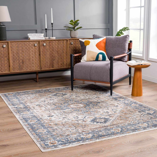 Living room with a patterned rug, sofa, and sideboard.