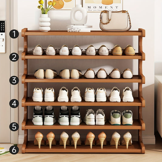 Bamboo shoe rack holding shoes in an entryway