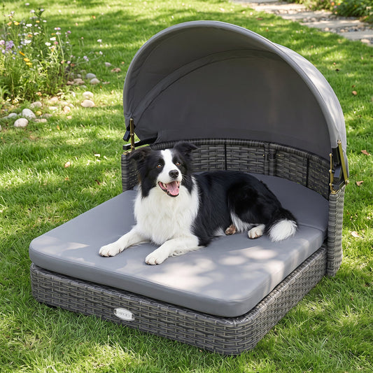 Wicker dog house with an adjustable shade canopy and cushions