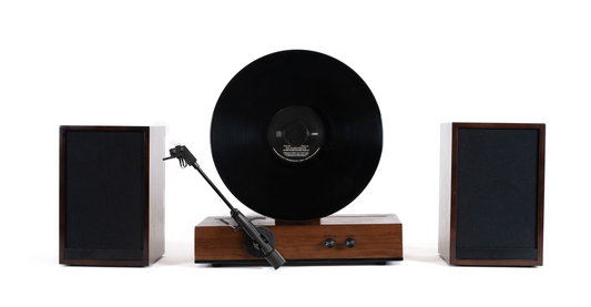 Vertical record player playing an LP mounted on a wall